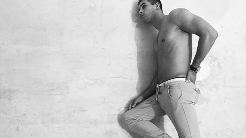 Midsection of shirtless man