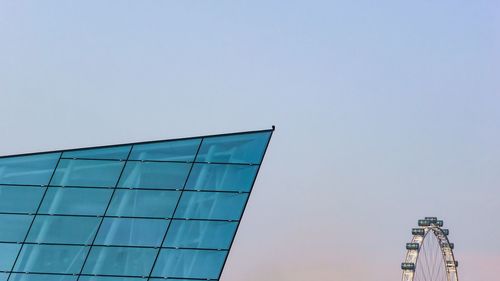 Low angle view of modern building against clear sky