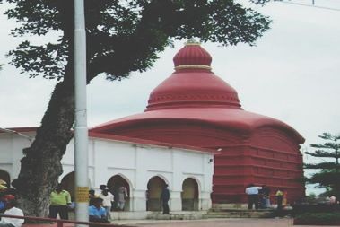 architecture, tree, built structure, building exterior, low angle view, religion, red, place of worship, spirituality, sky, day, arch, temple - building, outdoors, flag, cultures, entrance, railing