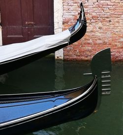 Close-up of boat moored in canal