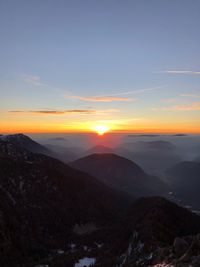 Scenic view of mountains against sky during sunset