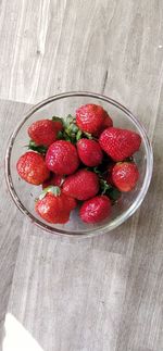 High angle view of strawberries in bowl on table