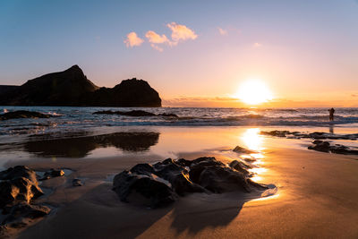 Scenic view of sea against sky during sunset