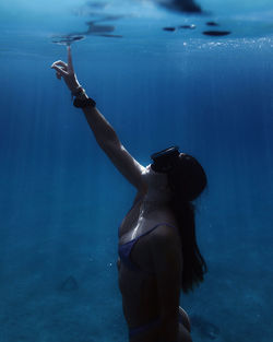 Woman diving in sea
