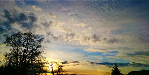 Scenic view of landscape against sky at sunset