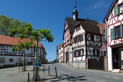 Street amidst buildings against sky