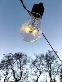 Low angle view of light bulb against sky