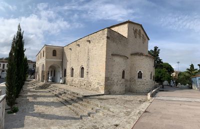 Historic building against sky in alacati 