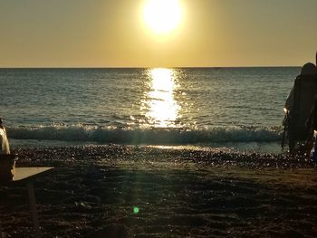 Scenic view of sea against clear sky during sunset