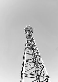 Low angle view of communications tower against clear sky