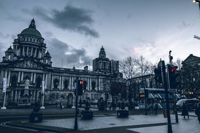 View of buildings against cloudy sky