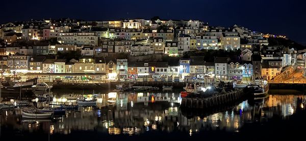 Illuminated buildings in city at night