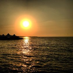 Scenic view of sea at sunset