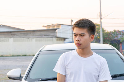 Side view of young man looking away