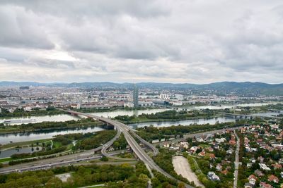 High angle view of street amidst buildings against sky