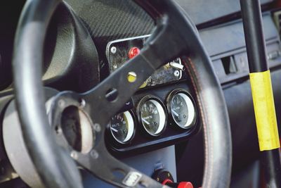 Close-up of steering wheel in car
