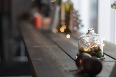 Close-up of glass bottle on table