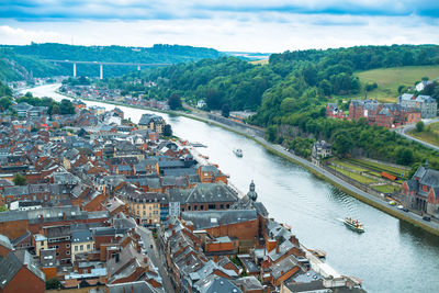 High angle view of harbor by river against sky