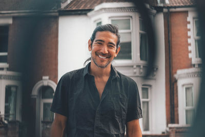 Person smiling while looking at the camera in england