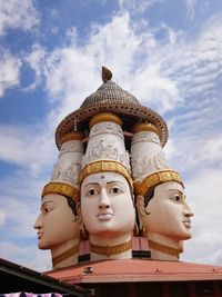 Low angle view of statue against building