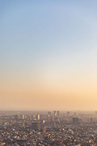 Aerial view of city at sunset