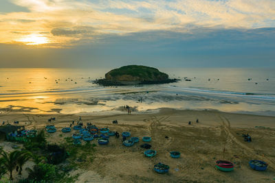 Scenic view of beach against sky during sunset