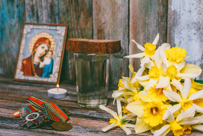 Close-up of yellow flowers on table