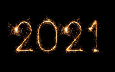 Firework display over black background