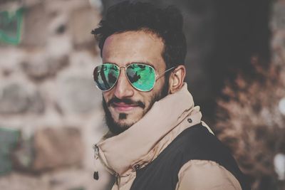 Portrait of young man wearing sunglasses