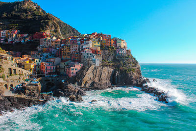 Panoramic view of sea against blue sky