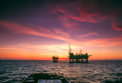 An offshore supply vessel approaching an oil platform in preparation for discharging cargo. 