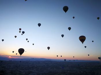 Low angle view of hot air balloons flying in sky