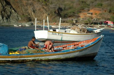 Boat moored in sea