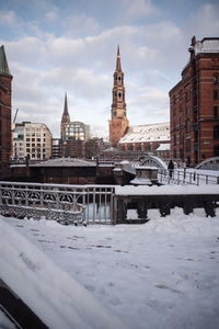 View of buildings in city during winter