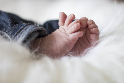 Close-up of baby sleeping on bed