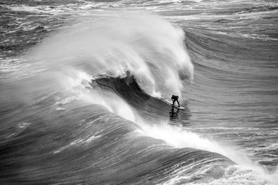 High angle view of man surfing at sea