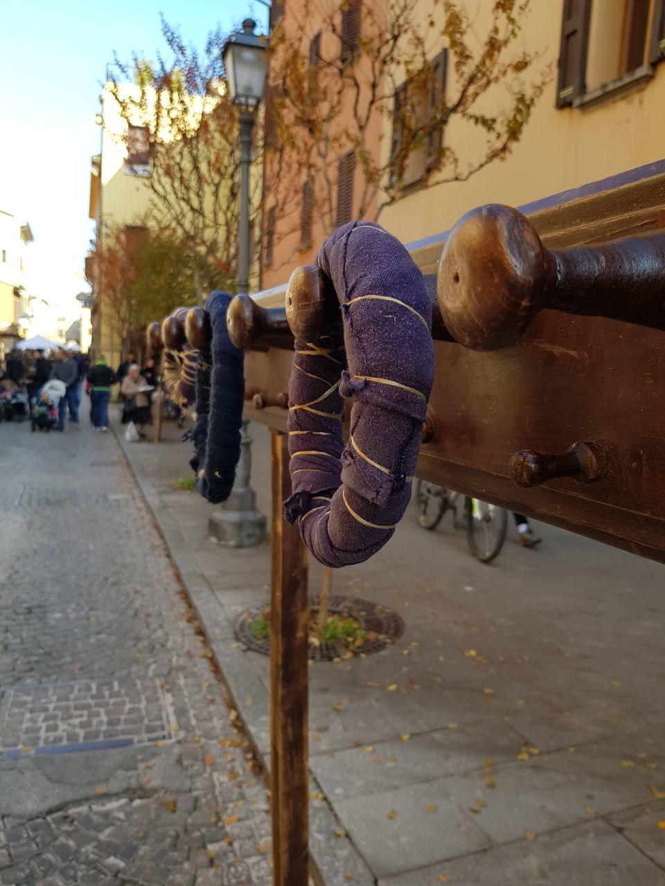 PEOPLE ON STREET BY FOOTPATH