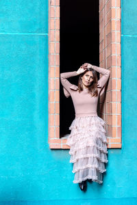 Woman sitting on window