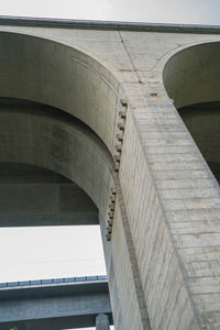 Low angle view of elevated road against sky