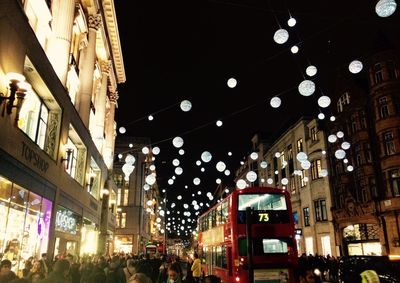 Illuminated buildings in city at night