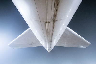 Low angle view of airplane flying against sky