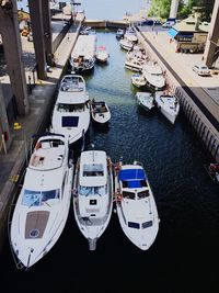 High angle view of boats moored at harbor