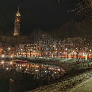 Illuminated buildings in city at night