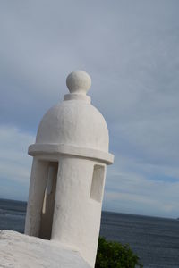 Close-up of statue against cloudy sky
