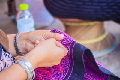 Close-up of woman holding hands