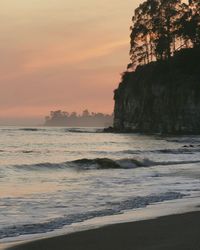 Scenic view of sea against sky at sunset