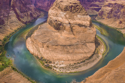 High angle view of rock formations at riverbank