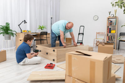 Rear view of man working at home