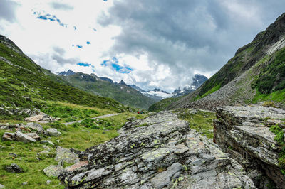 Scenic view of mountains against cloudy sky