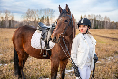 Horse standing on field